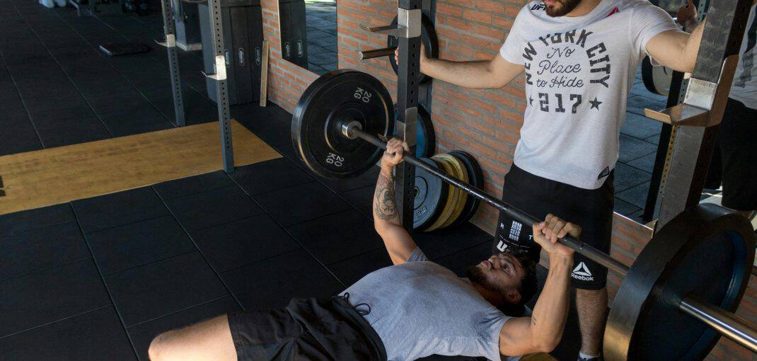 Two men doing bench press