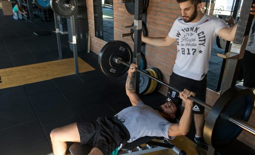 Two men doing bench press