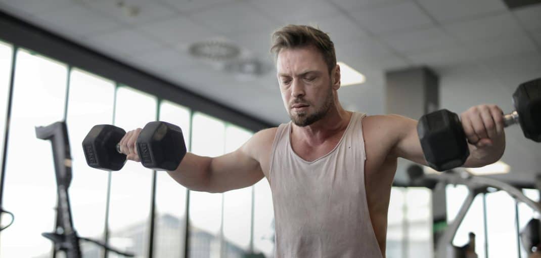 Men doing lateral raises