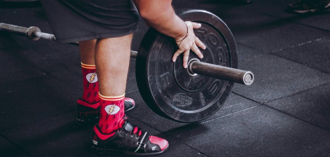 Man putting weights on