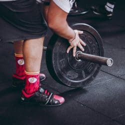 Man putting weights on