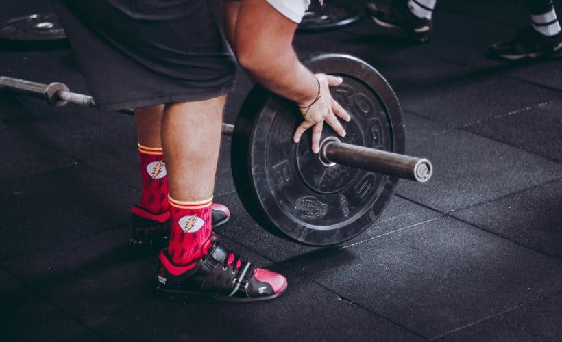 Man putting weights on