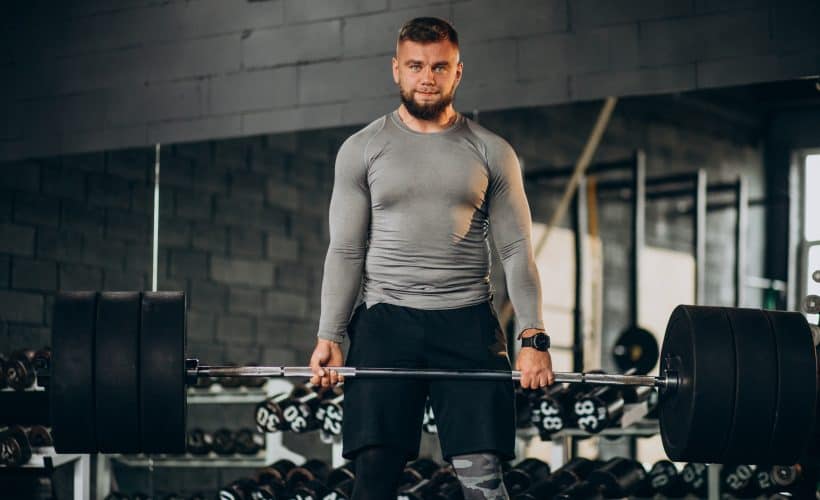 Strong man exercising at the gym