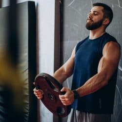 Strong man training in gym