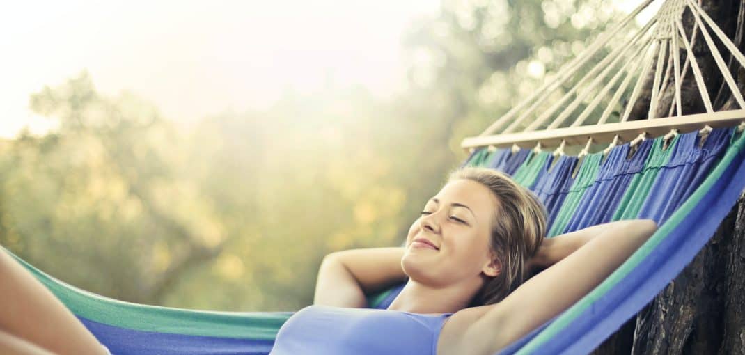 Woman relaxing in a hammock