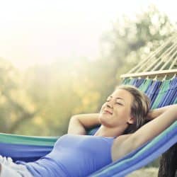 Woman relaxing in a hammock