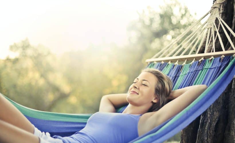 Woman relaxing in a hammock